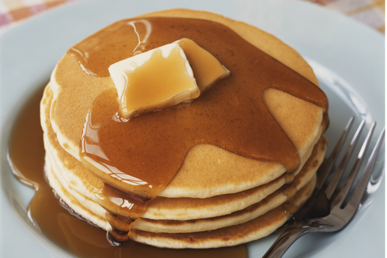 Pancake with butter and maple syrup