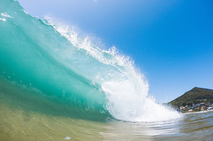 Wave crashing into the beach